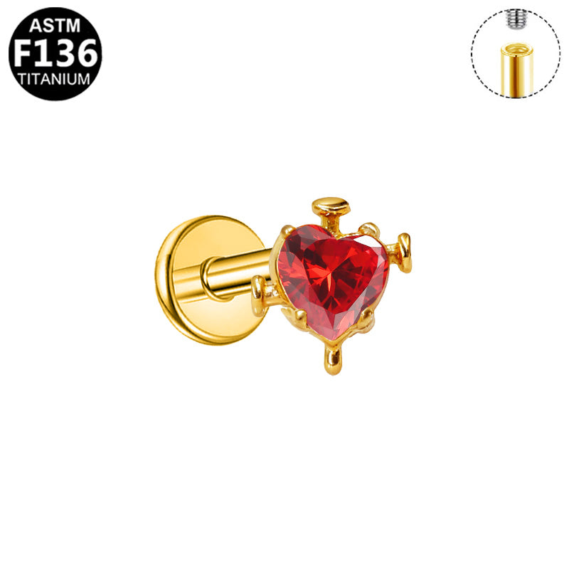 Piercing cœur rouge clouté en titane doré
