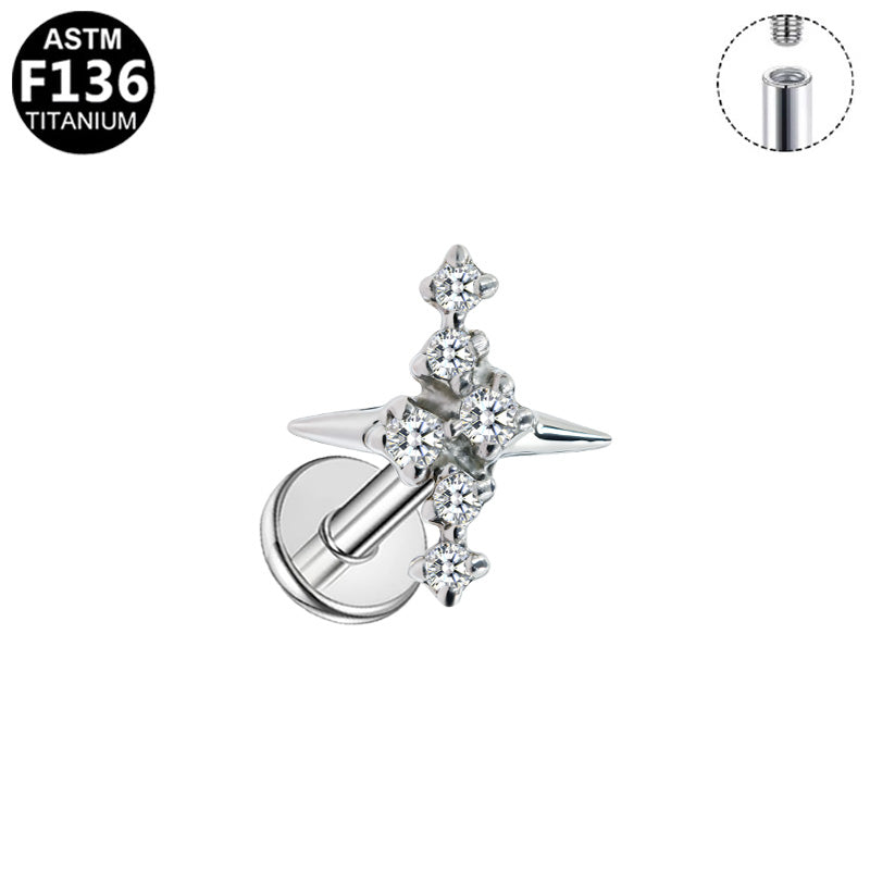 Piercing croix étoilée strass en titane argenté