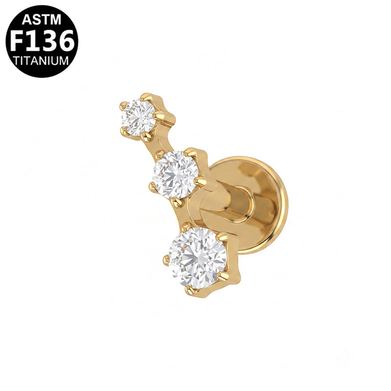 Piercing trio de zircons en titane doré